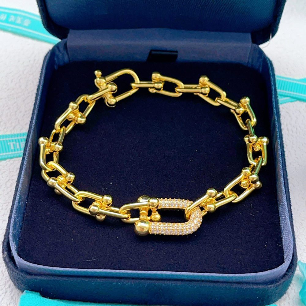 Tiffany & Co. U-shaped gold bracelet with diamonds
